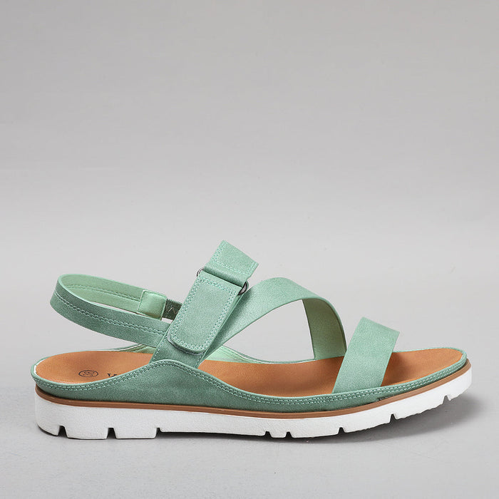 Pink VS Treads Yaryna Mint sandals shown from side, featuring open toe design and stylish straps.