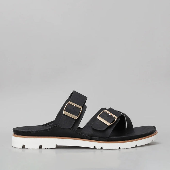 Black CC Resorts VS Treads Yen flats shown from the side, featuring a sleek design and comfortable flat sole.