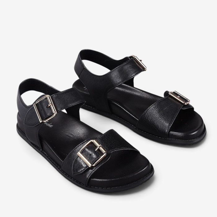 Naked Arches Ziggro Black sandals featuring sleek black straps and cushioned footbed, designed for comfort and style.