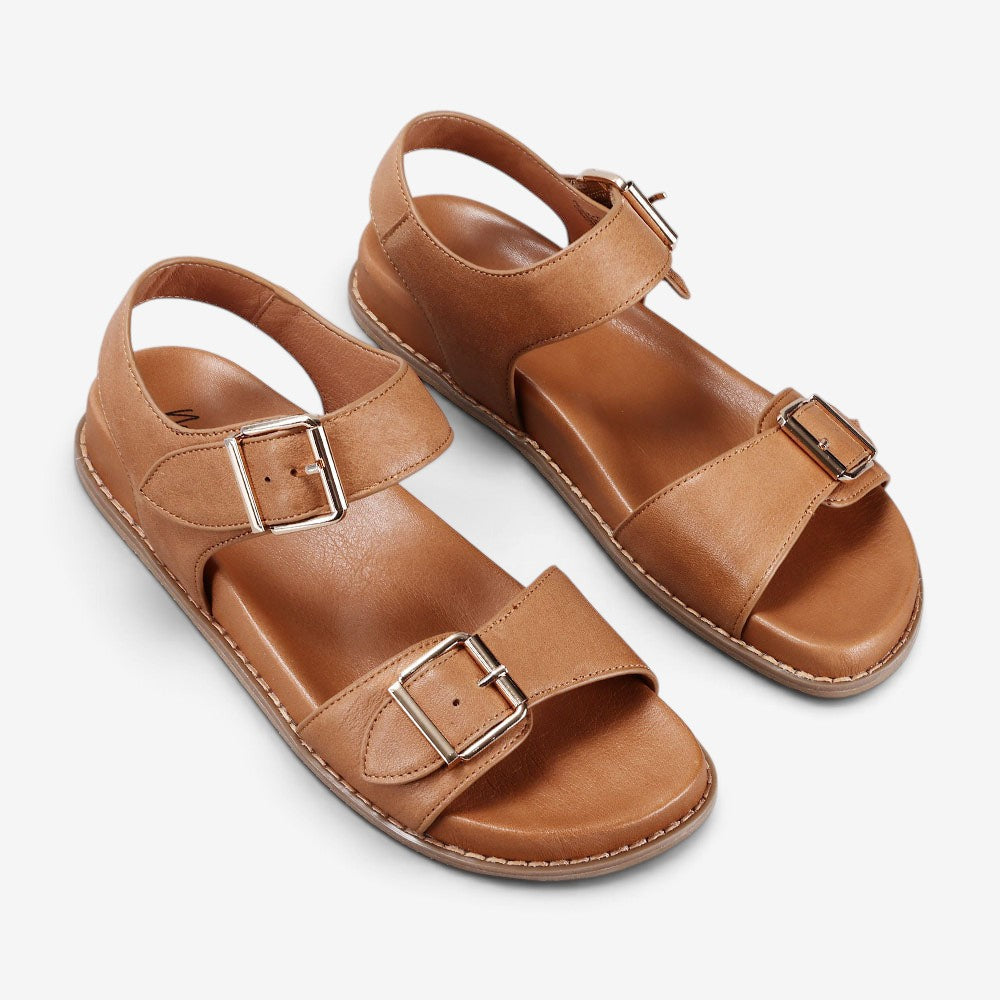 Naked Arches Ziggro Tan sandals with natural leather straps and flat sole, stylish and comfortable footwear for casual wear.