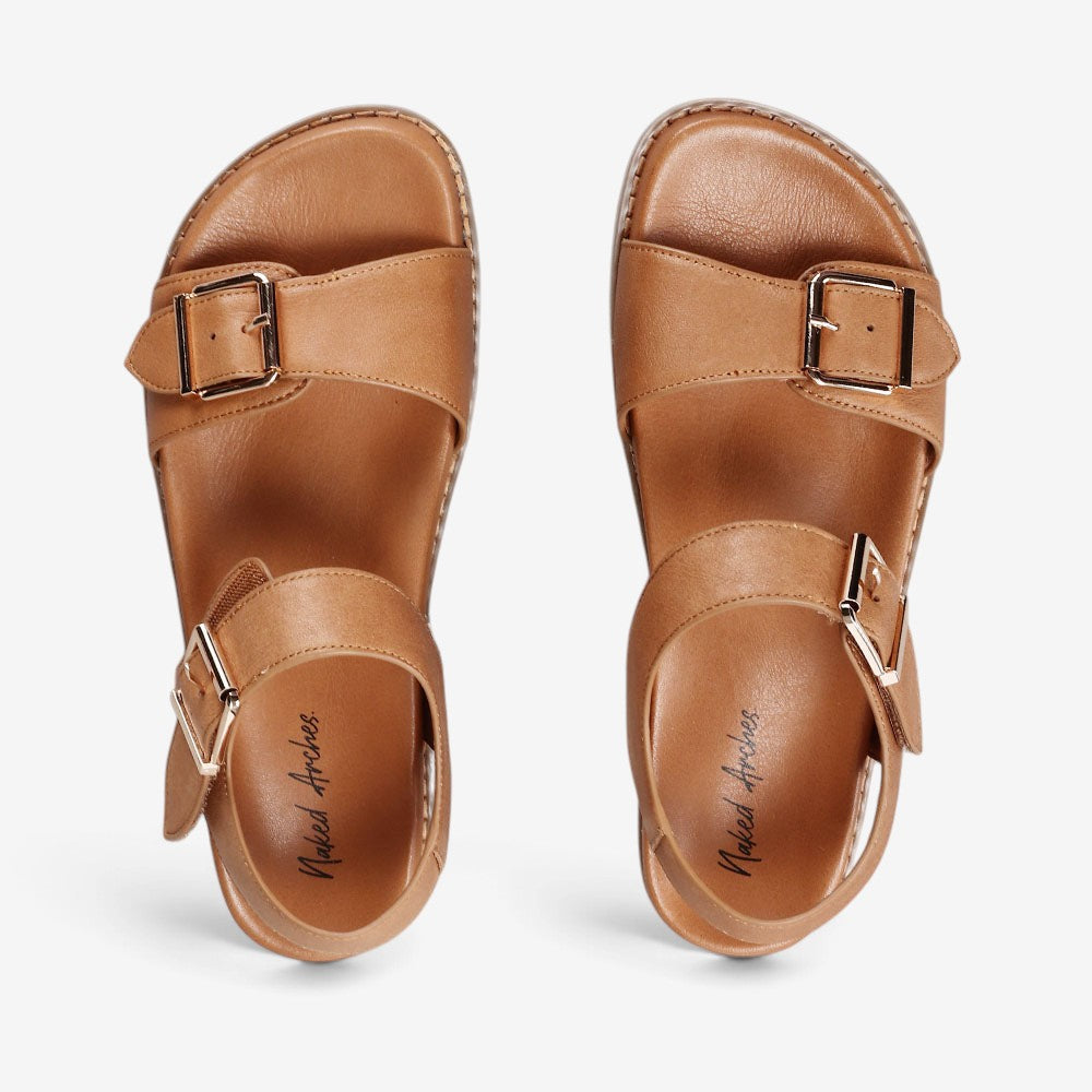 Naked Arches Ziggro Tan sandals featuring natural leather straps and cushioned soles for comfortable casual wear.