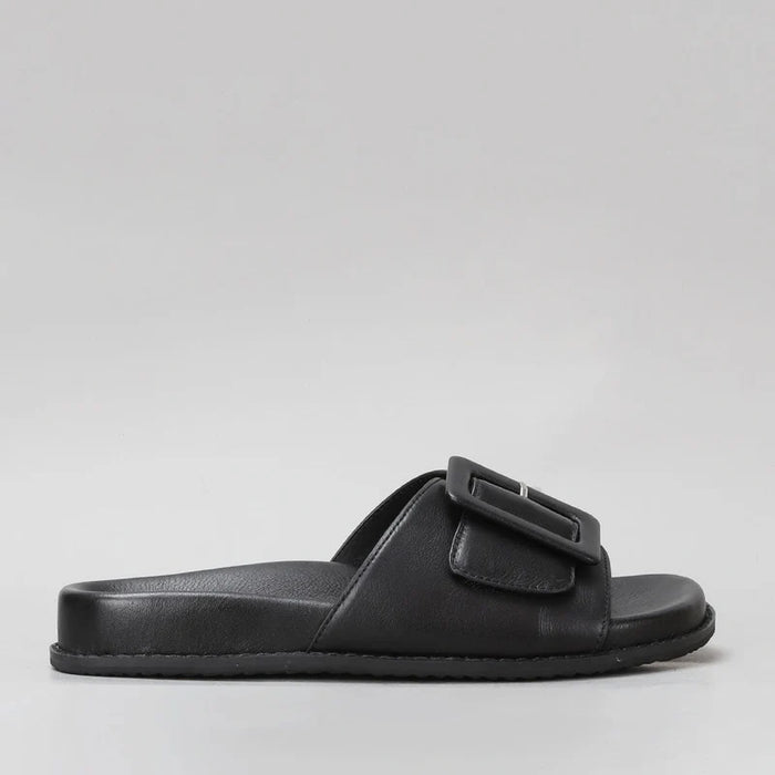 Naked Arches Zolanda Black slip-on shoes shown from the side, featuring sleek black design and comfortable casual style.