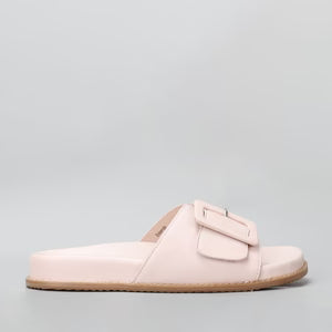 Naked Arches Zolanda blush slip-on shoes with a sleek design and blush pink color, shown from the side view.