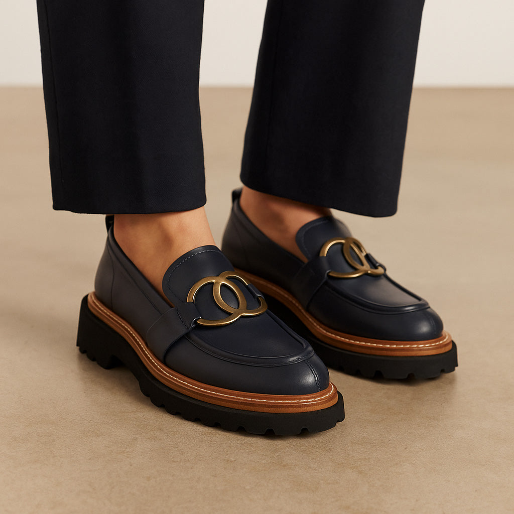 Eos Abbi Navy loafers for women, featuring classic slip-on design in navy blue leather with a rounded toe and stylish stitching.
