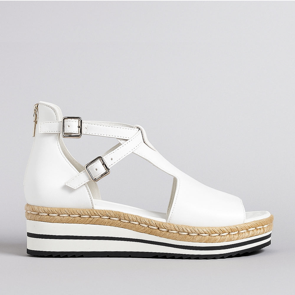 White Django & Juliette Alexys sandals with ankle straps and open toe design, perfect for casual and summer wear.