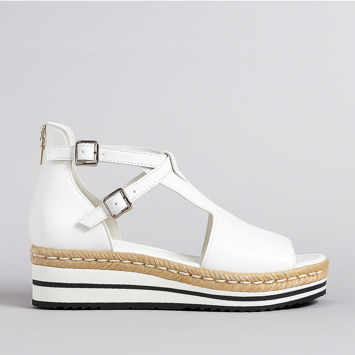 White Django & Juliette Alexys sandals with ankle straps and open toe design, perfect for casual and summer wear.