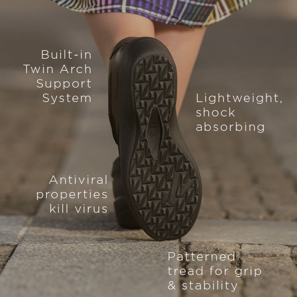 Black Arcopedico Paluma boots with a sleek, slip-on design and rounded toe, displayed on a neutral background.