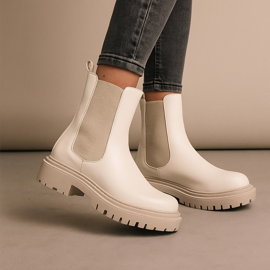 Le Sansa Rebecca vanilla boots featuring stylish design and comfortable fit, shown in a natural side view.