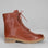 LE SANSA Besty Tan boots featuring a sleek design, ankle-high style, and tan leather finish, displayed on a neutral background.