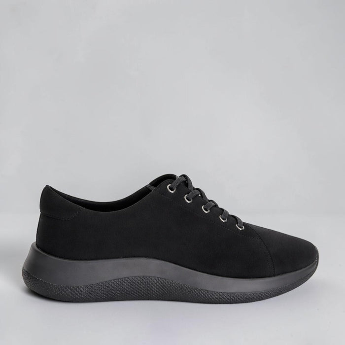 Black Arcopedico Daintree sneakers with a sleek design, showcasing comfortable slip-on footwear for casual wear.