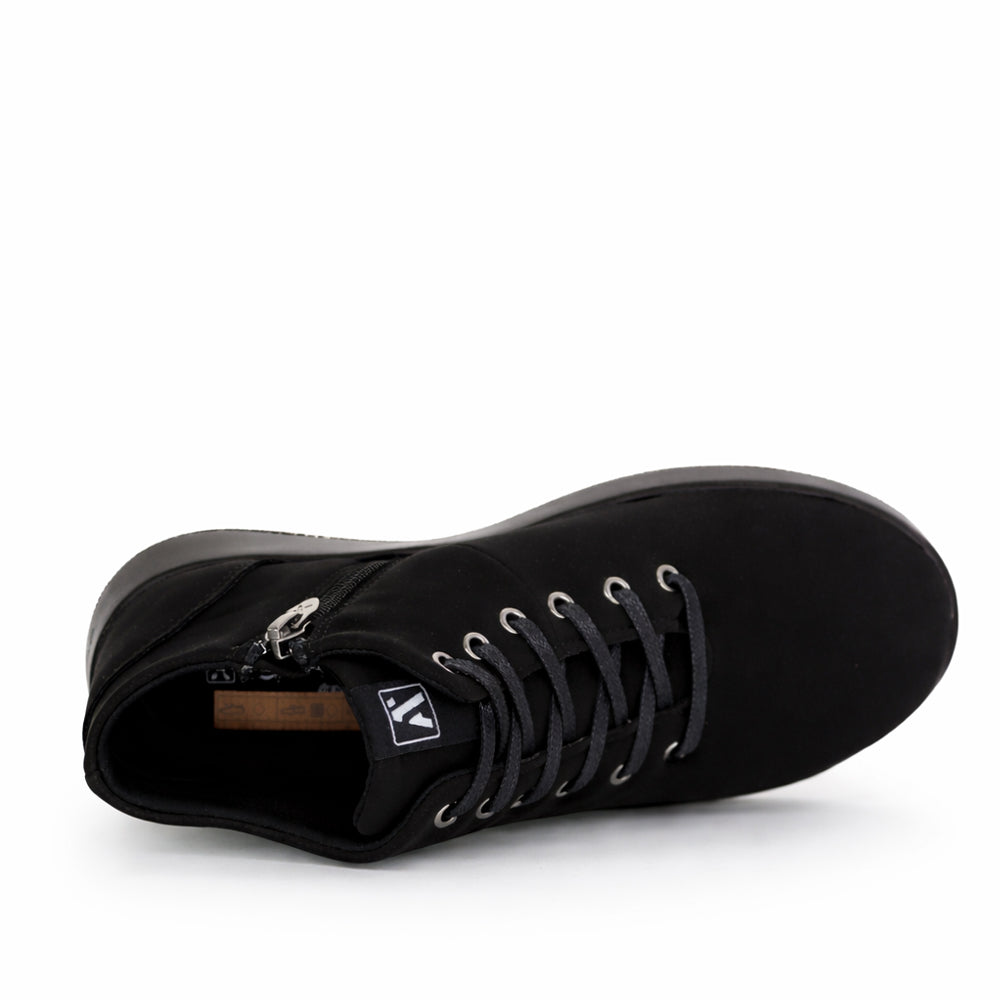 Black Arcopedico Tatra boots with sleek design and comfortable fit, shown in a close-up image.