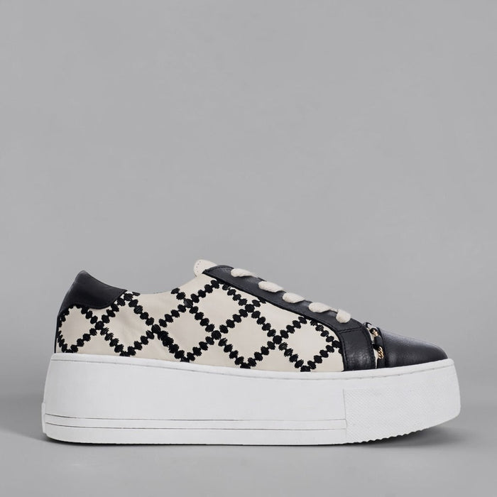 Black ALFIE & EVIE Frankie sneakers with white soles, showcasing a stylish, casual design and comfortable fit.