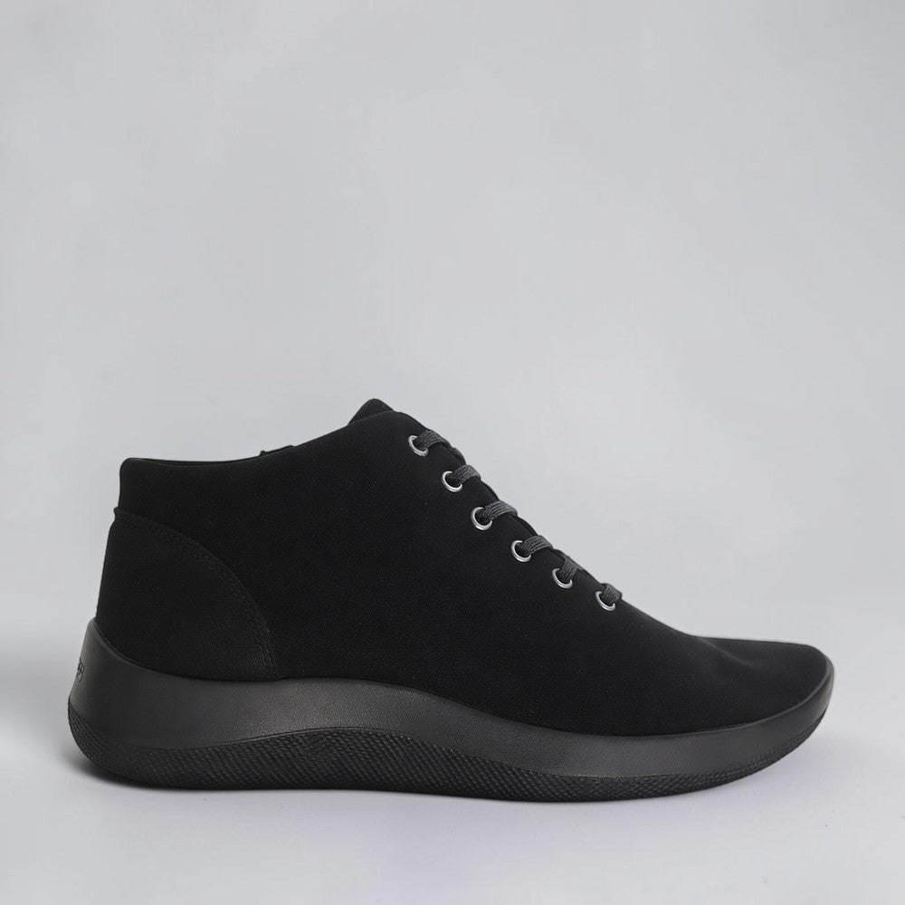 Black Arcopedico Tatra boots with rounded toes and slip-on design, showcasing their comfortable, stylish footwear style.