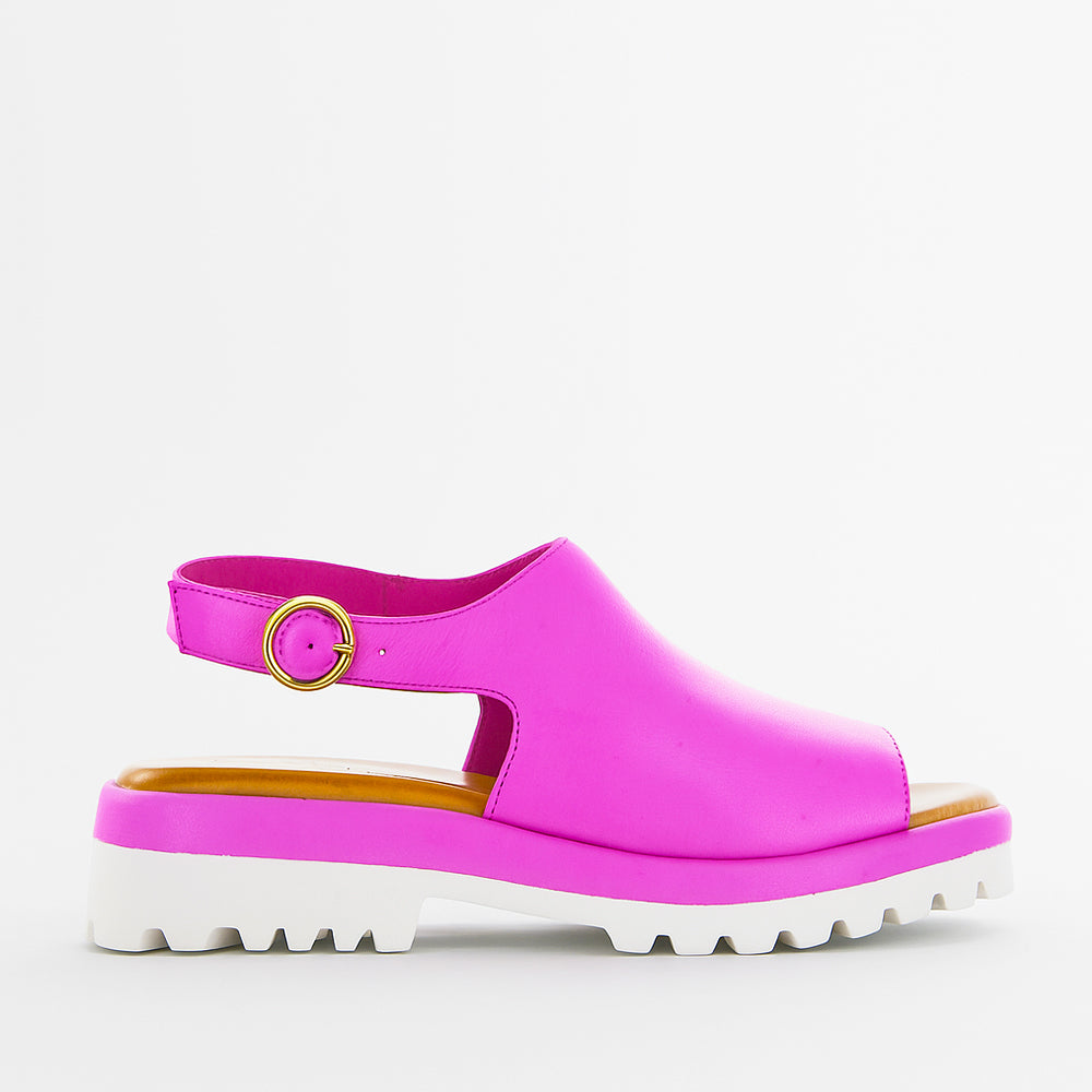 Le Sansa Briar Hot Pink sandals with open toes and ankle straps, featuring a vibrant pink color and stylish design.