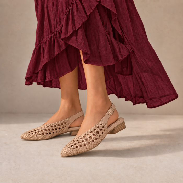 Le Sansa Camila Sandals featuring beige straps and flat sole, perfect for casual summer wear.