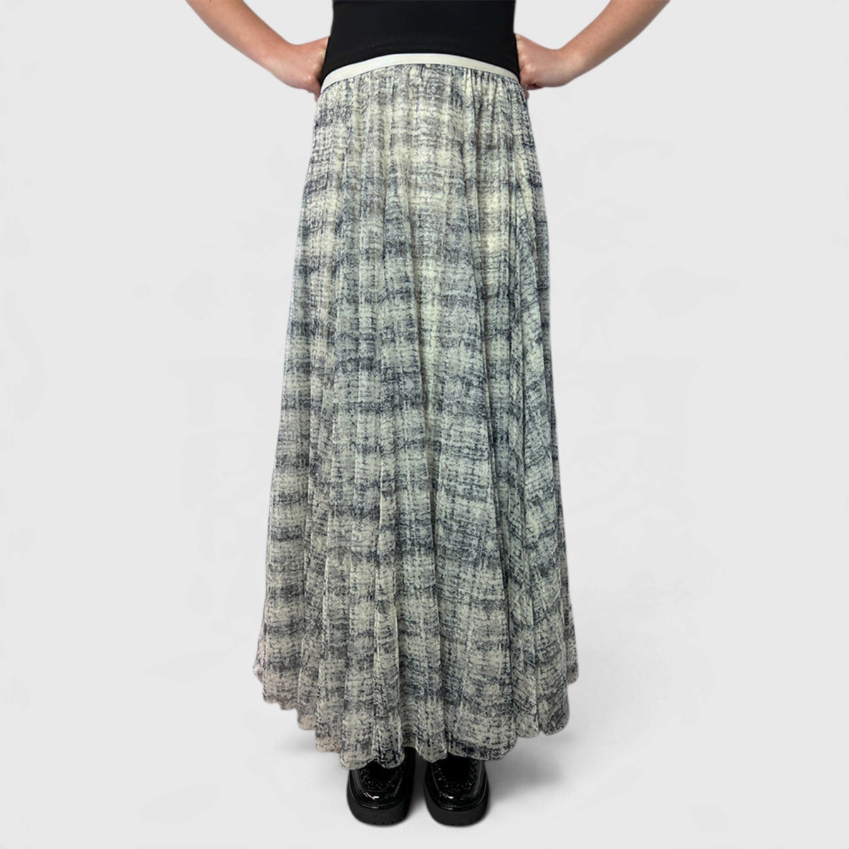 Minx Swan Lake Tulle Coco Butter Long Skirt featuring flowing tulle fabric and a elegant silhouette in a soft coco butter hue.