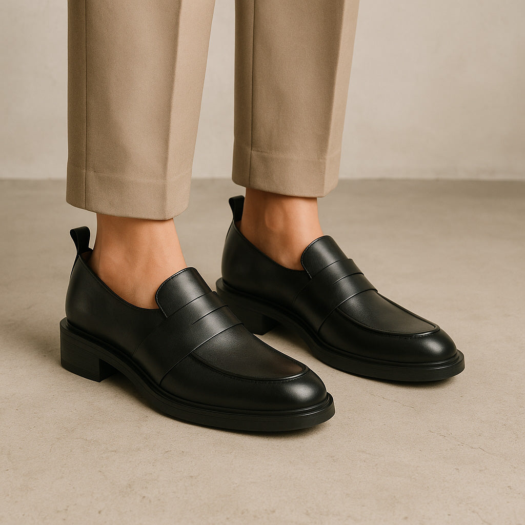 Eos Coia Black loafers showing sleek black leather upper and classic slip-on design for casual or smart wear.