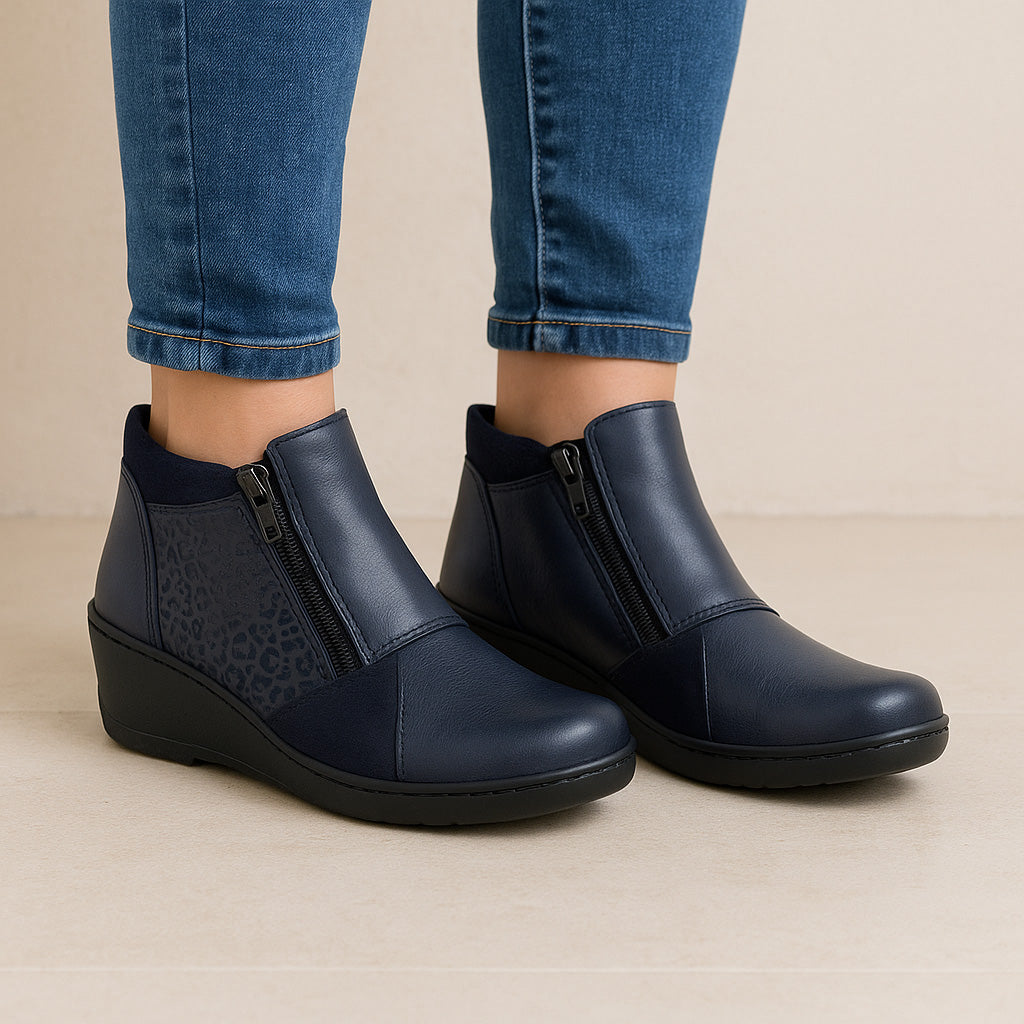 Navy Cabello CP462-18 boots with ankle-high design, featuring sturdy sole and stylish lacing details.