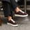 NAKED ARCHES Azealia Choco sneakers with brown and beige color-block design, casual slip-on style, and textured sole.