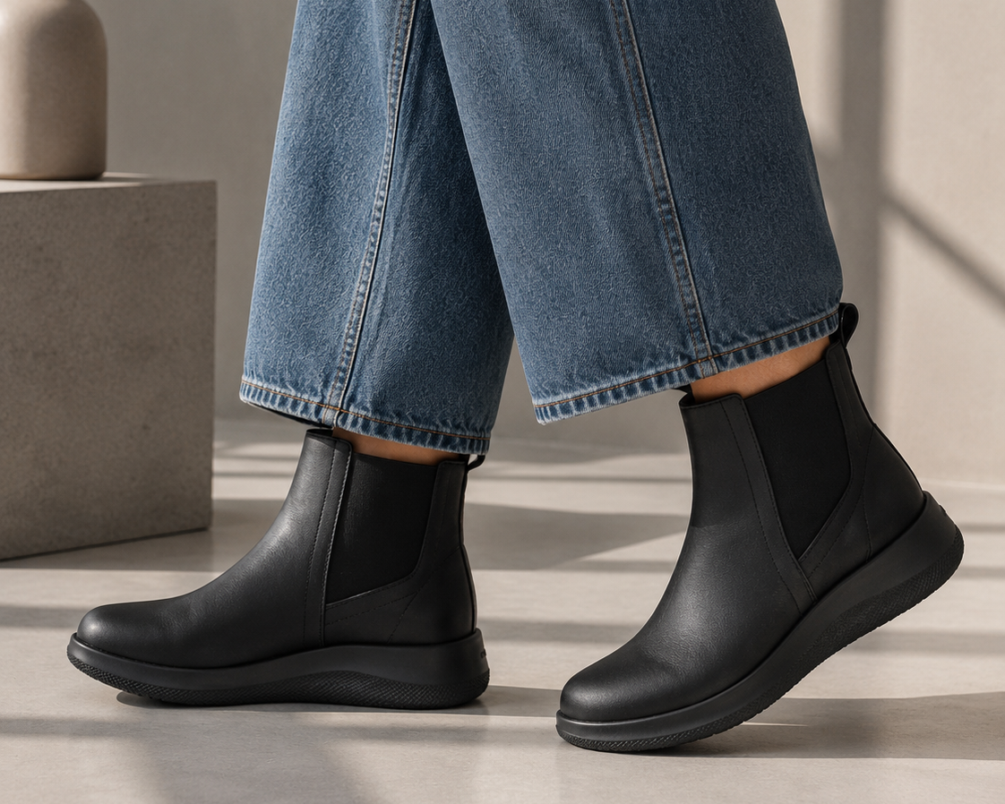 Arcopedico Rago black and grey leather boots with rounded toes and comfortable slip-on design.
