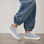 NAKED ARCHES AZEALIA denim sneakers with white laces and rubber sole, featuring a casual, stylish design.