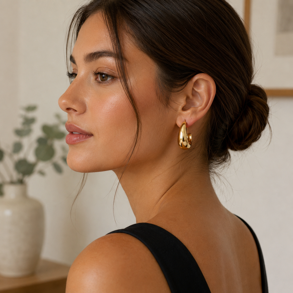 A & C Oslo PURE STEEL SOFT EARRING in gold, featuring a sleek, minimalist design for elegant everyday wear.