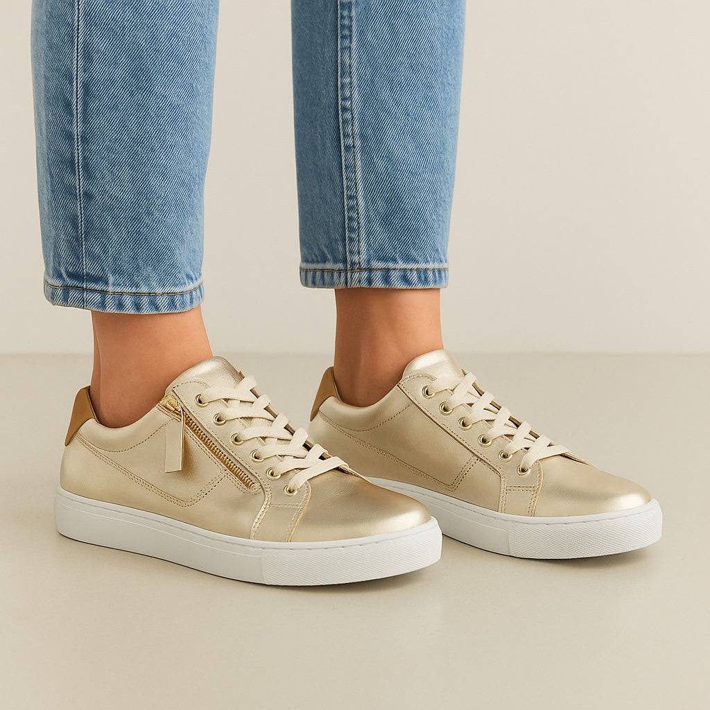 Cabello EG520 Gold sneakers with sleek design, featuring gold accents and comfortable white soles.