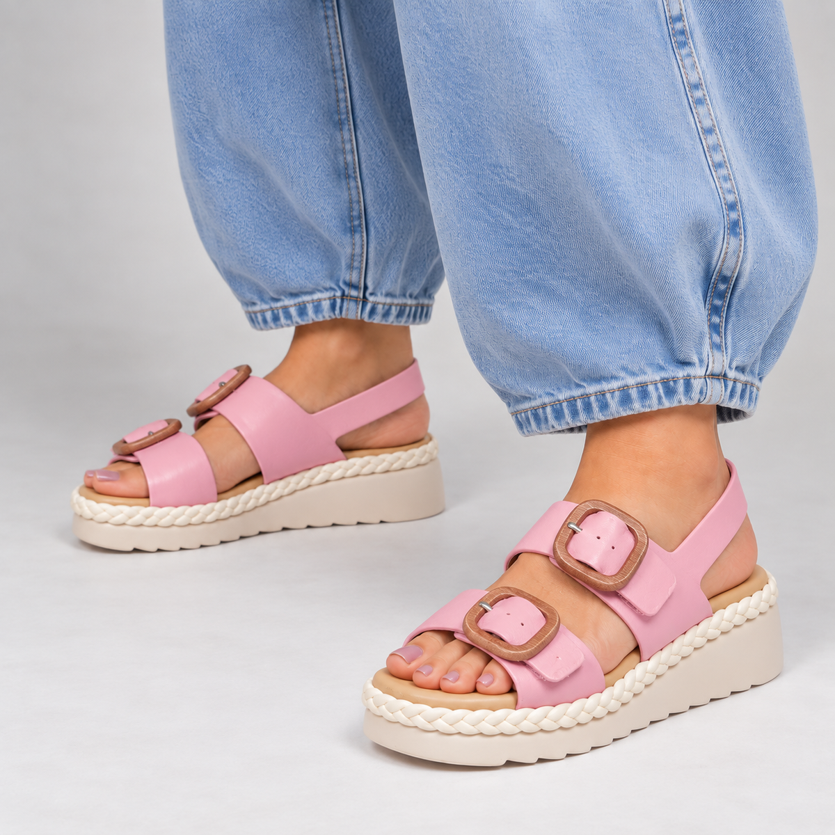 Le Sansa Emery baby pink sandals with open toes and strap design, perfect for stylish little footwear.