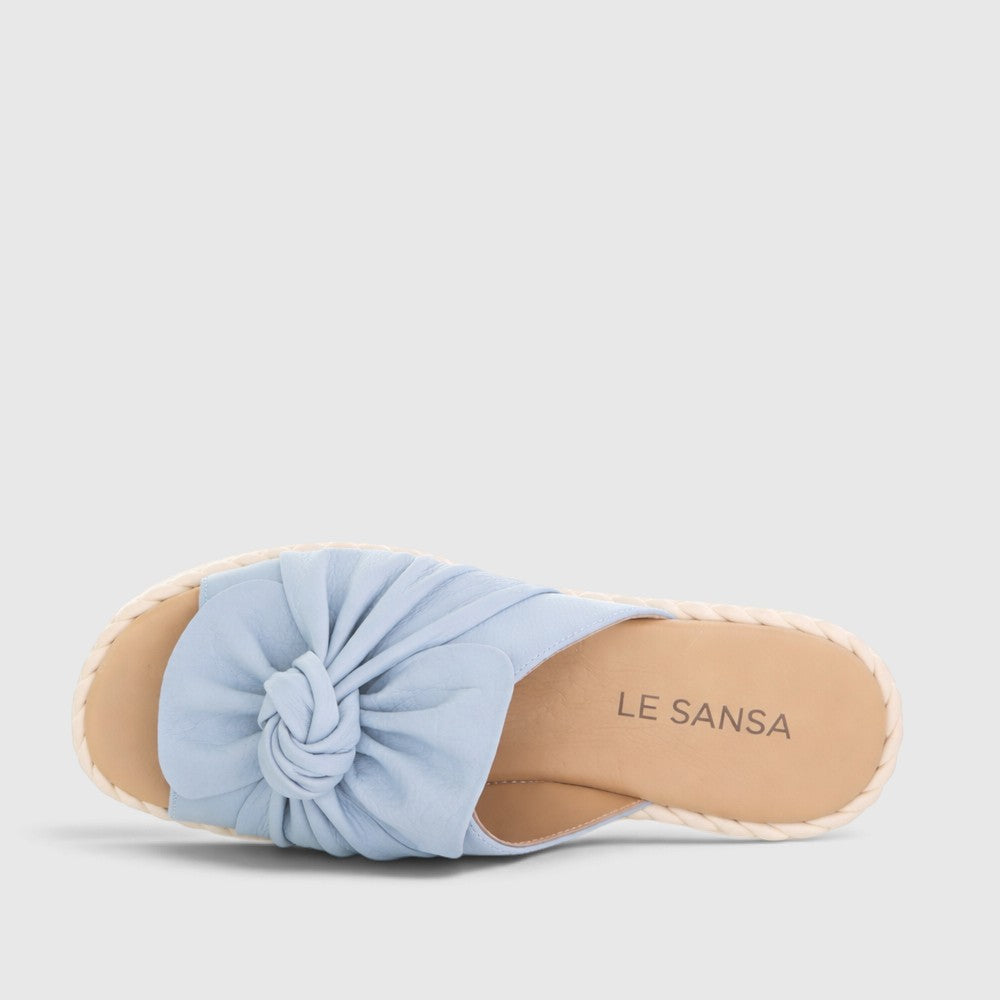 Le Sansa Eudore baby blue slip-on shoes for infants, featuring soft fabric and comfortable design for little feet.