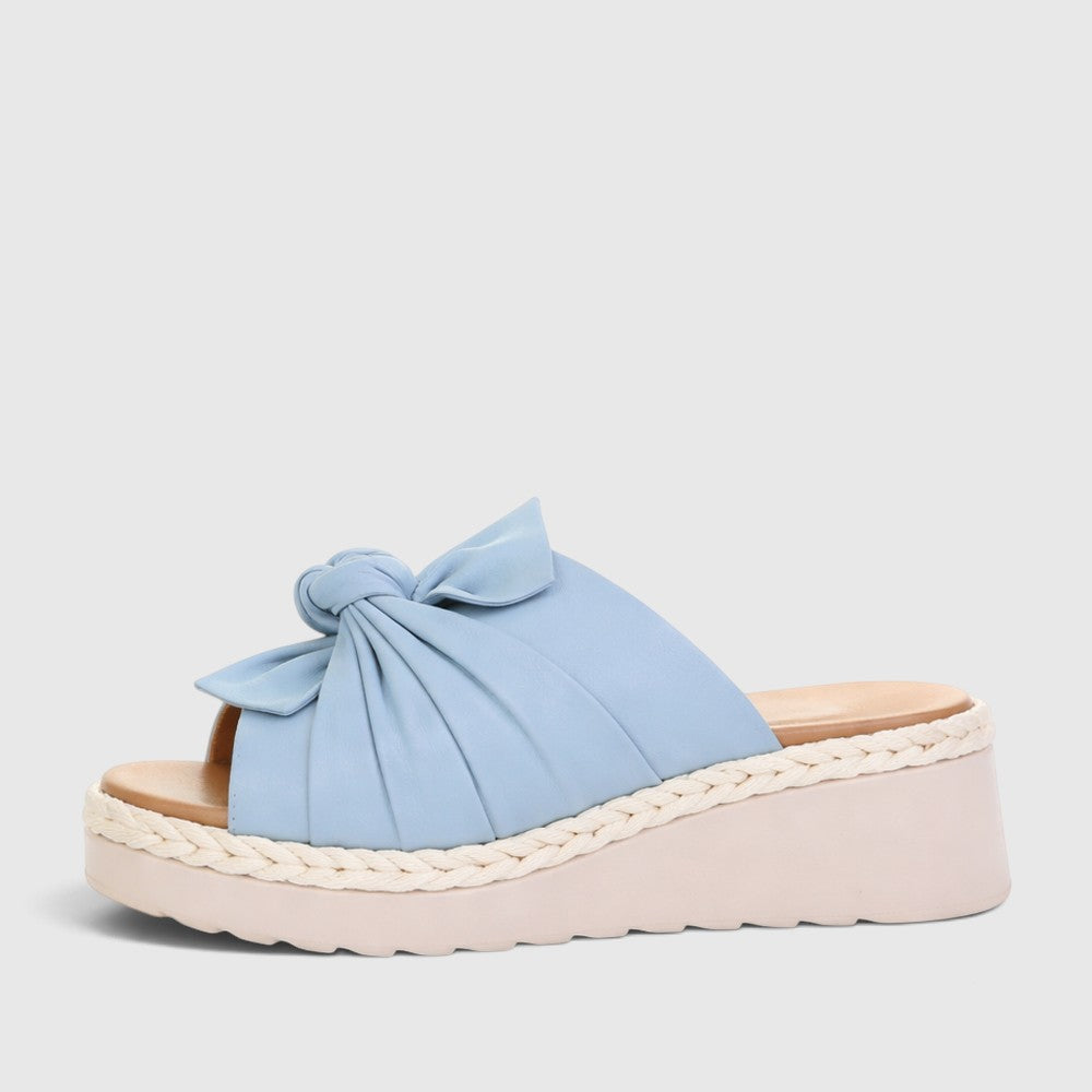 Le Sansa Eudore baby blue slip-on shoes for toddlers, featuring soft fabric and comfortable fit, perfect for everyday wear.
