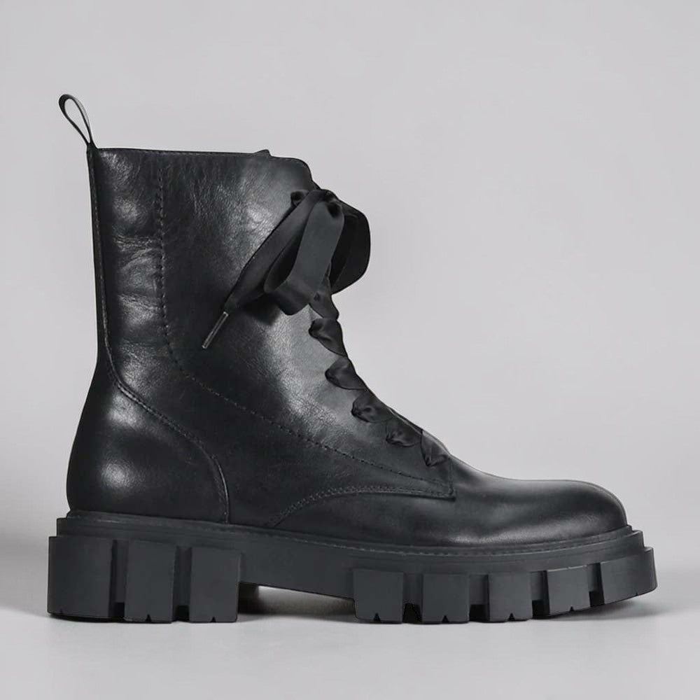 Black EOS FEBE boots featuring a sleek, stylish design with laces and a sturdy sole, perfect for casual or dressy wear.