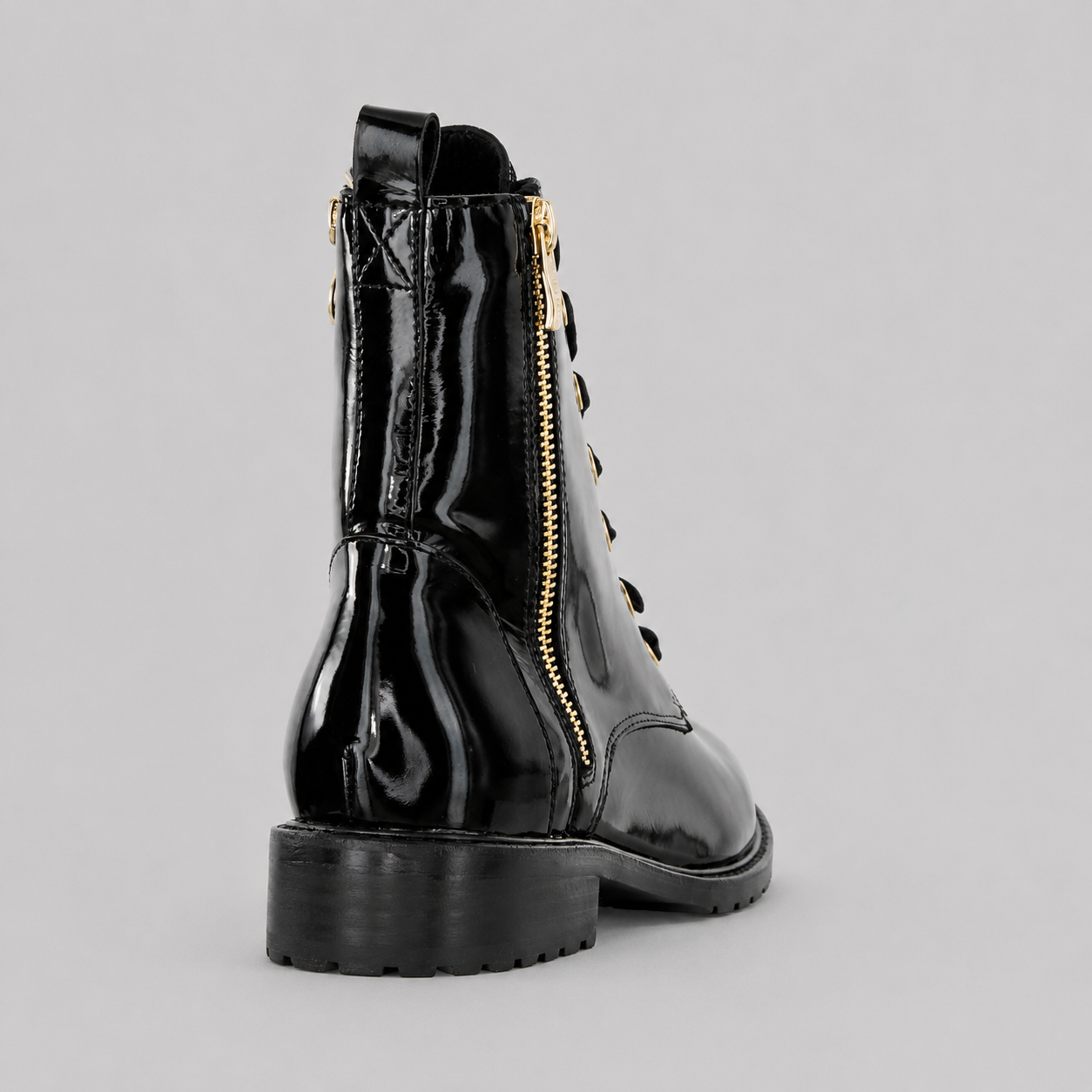 Black patent LE SANSA Sansa Fin boots with sleek, glossy finish and pointed toes, styled with a low block heel.