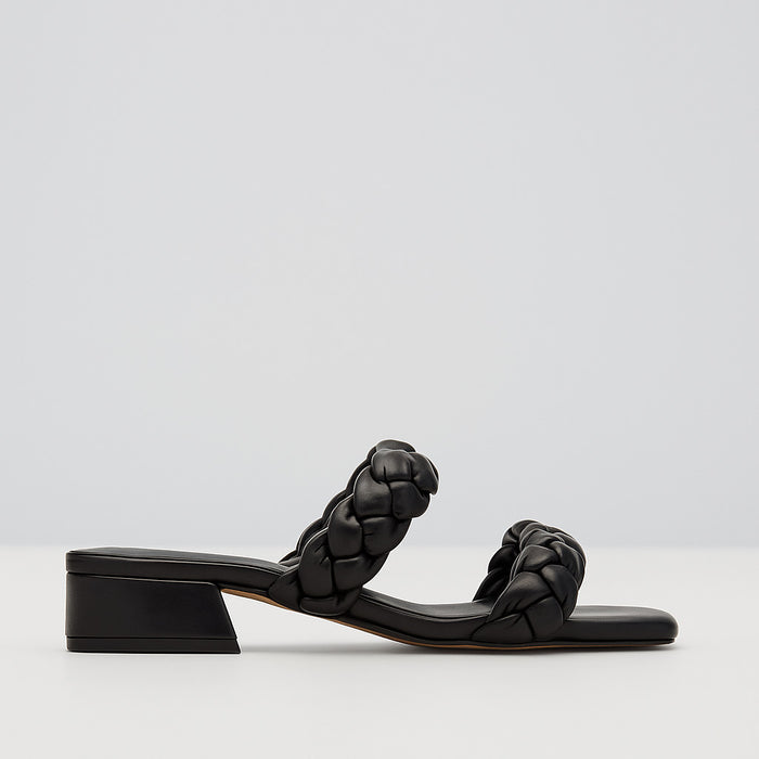 Black Le Sansa Gillian slip-on shoes with sleek design and comfortable fit, perfect for casual or office wear.