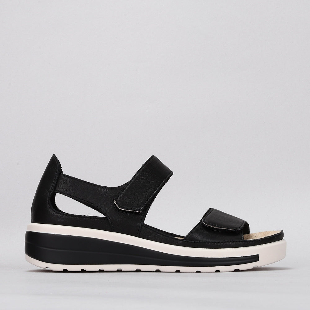 Naked Arches Happy Black sandals with cushioned straps and contoured footbed, designed for comfort and casual style.