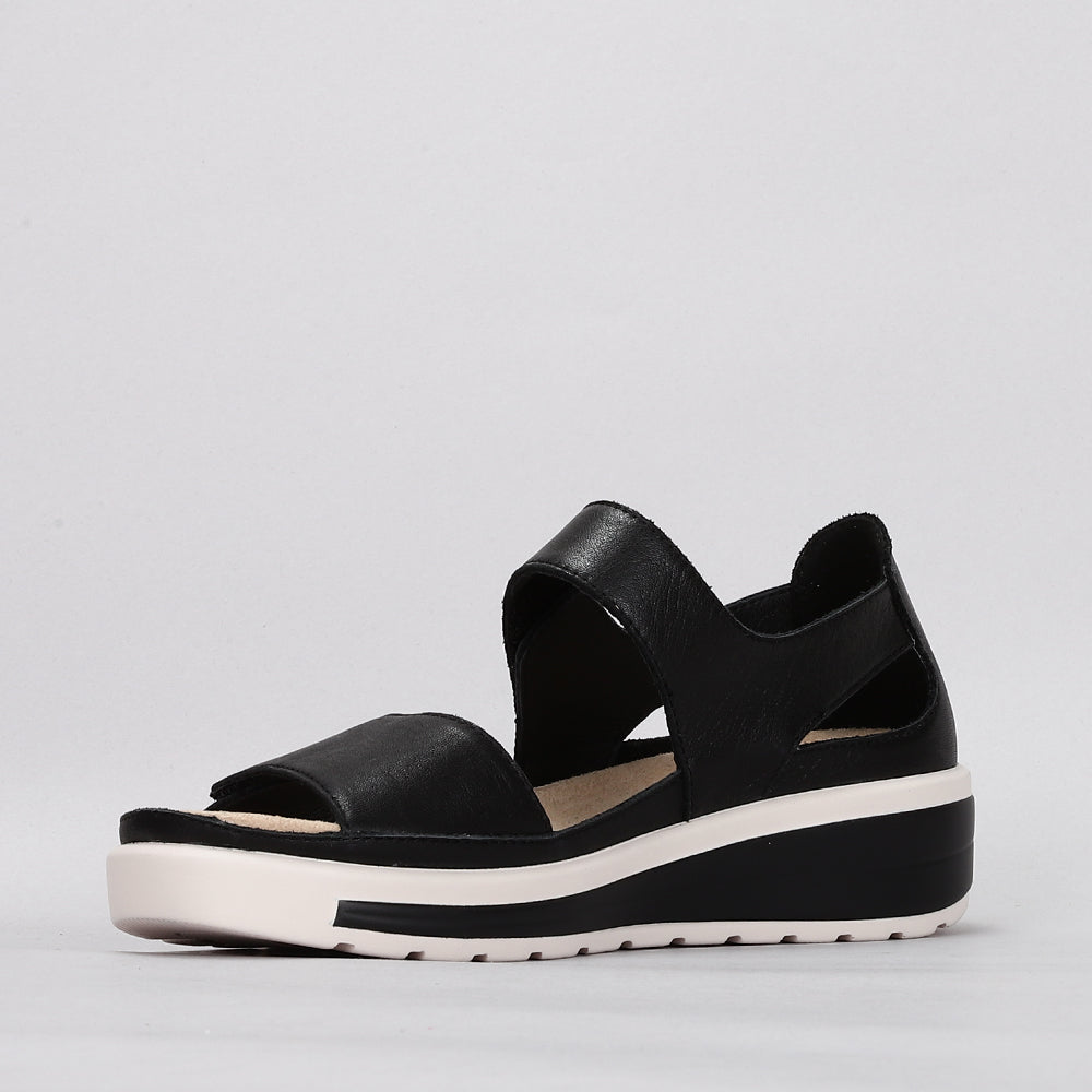 Naked Arches Happy Black sandals featuring black straps and cushioned footbed, designed for comfort and casual wear.