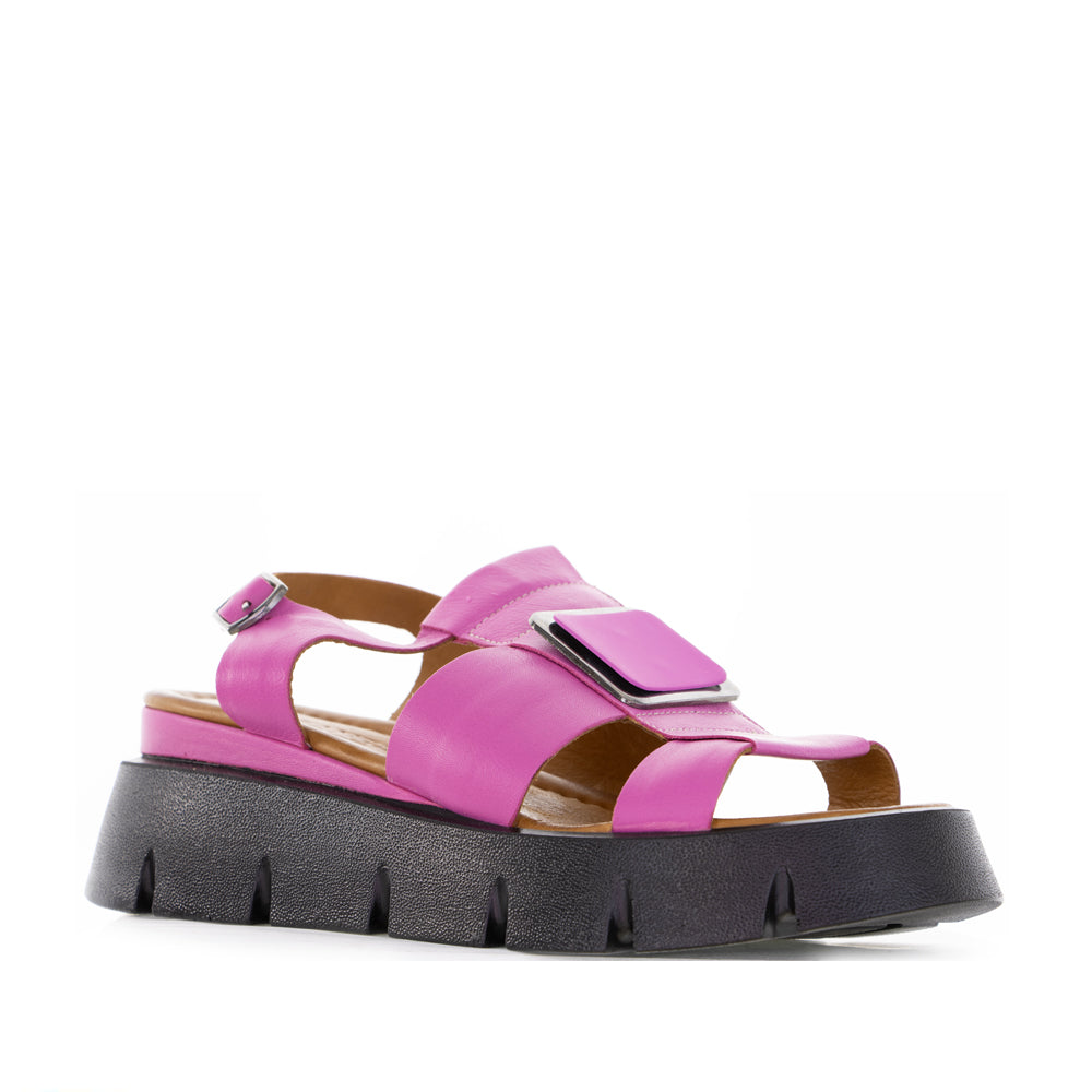 Le Sansa Hindi Hot Pink sandals with open toes and ankle straps, showcasing vibrant fuchsia color and stylish design.