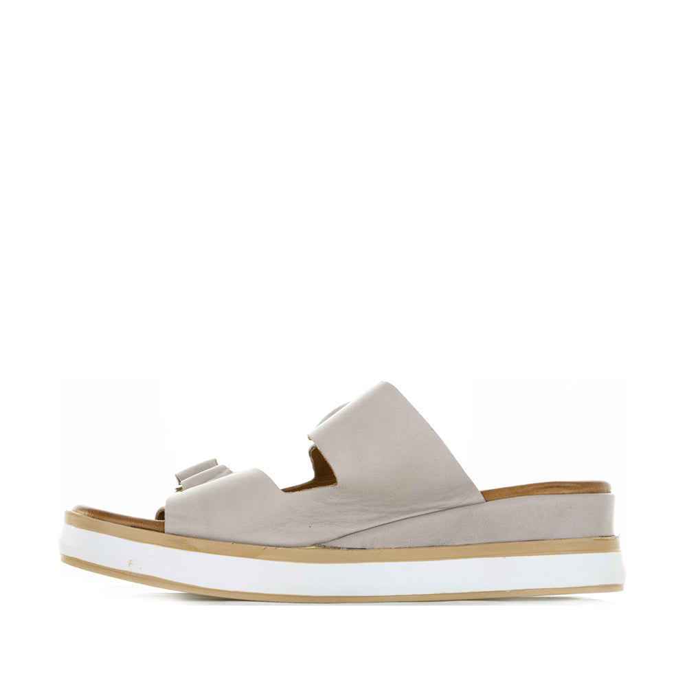 Le Sansa Holister slip-ons in silver grey with a sleek design and comfortable fit, shown in the image.