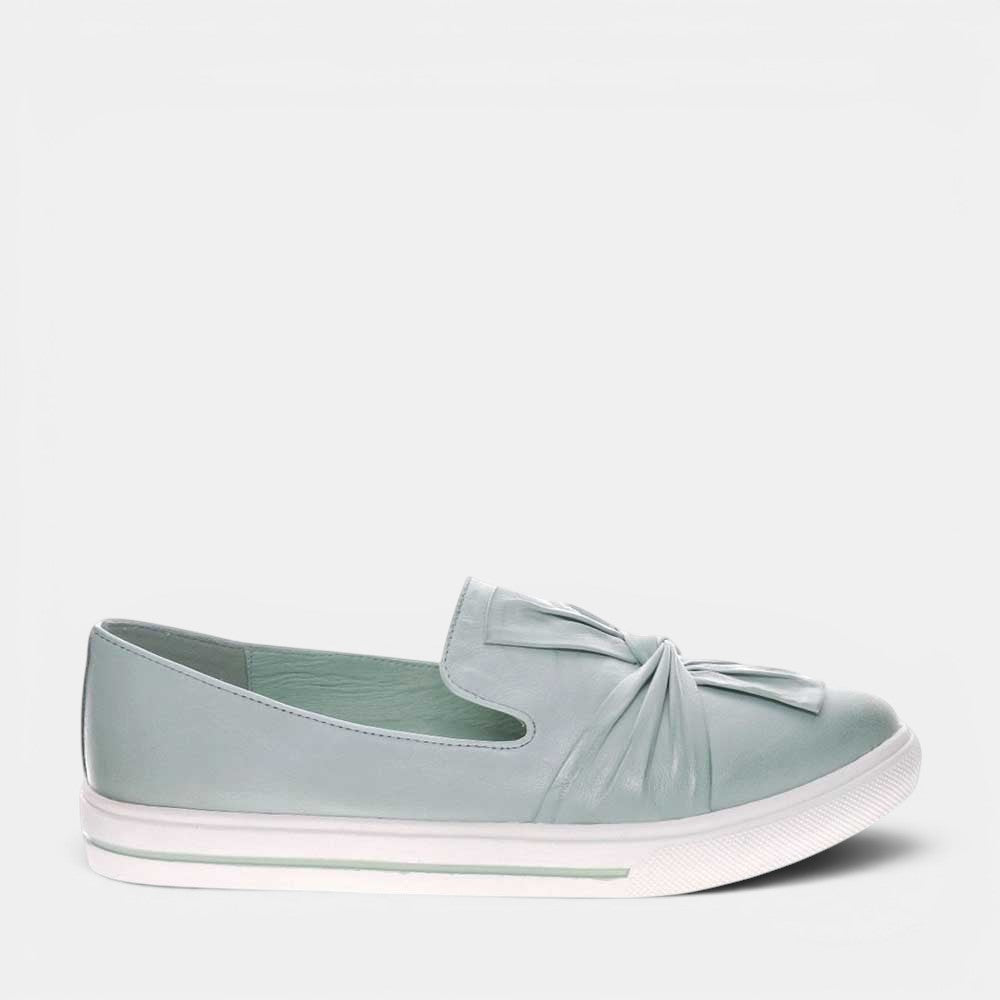 LE SANSA Izzy Mint slip-ons with a sleek design and mint green color, perfect for casual wear.