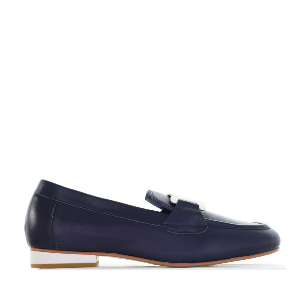Naked Arches navy and white loafers featuring a sleek design and comfortable fit, shown in the image.