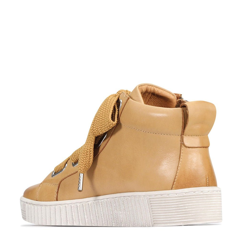 Eos Joyous Tan boots featuring high-top design, stylish tan leather, and ankle laces, showcased in a close-up shot.