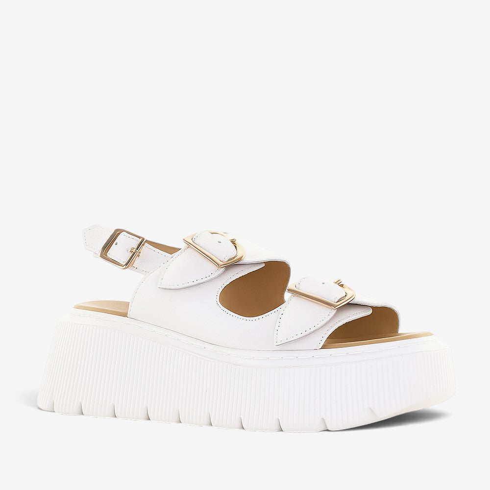 White LE SANSA CENO sandals with straps and open toe design, featuring a comfortable flat sole and stylish look.