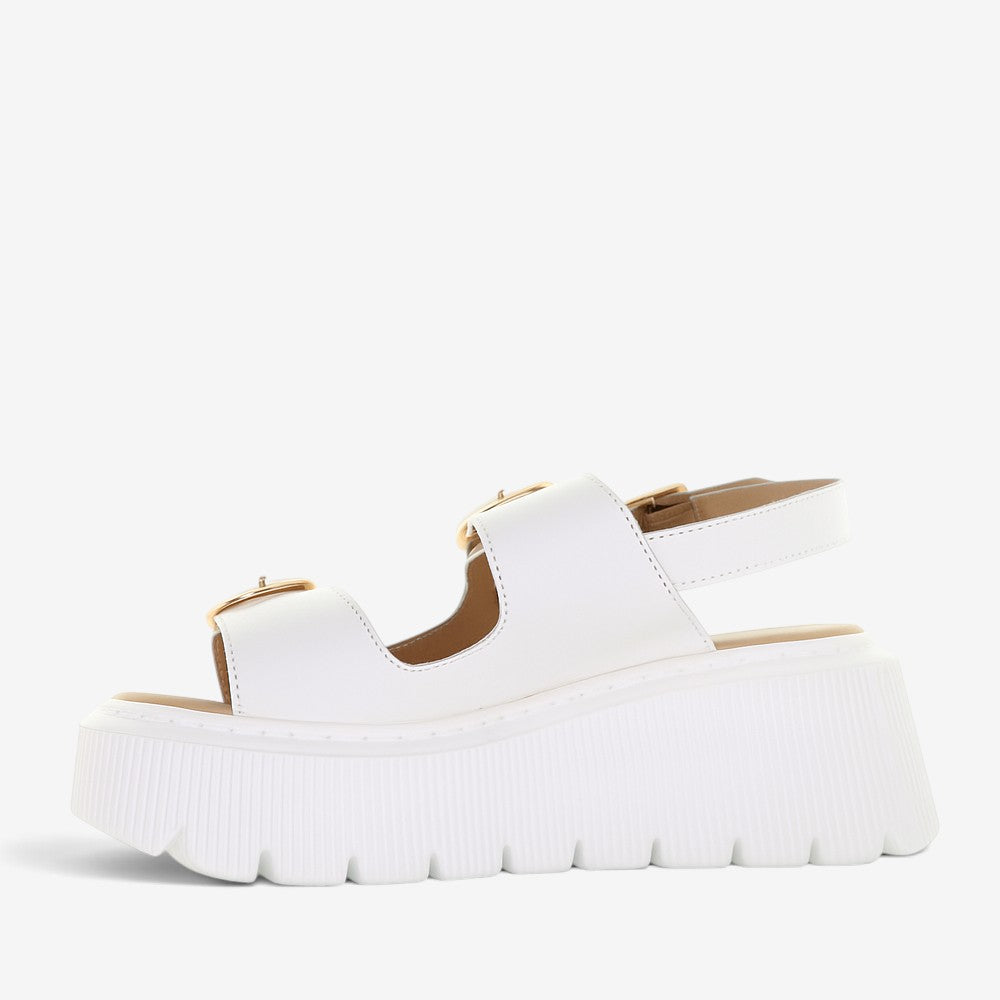 White LE SANSA CENO sandals with minimalist design and open toe, featuring a comfortable flat sole and stylish straps.