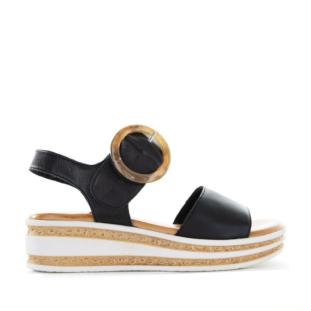 Black Le Sansa Guard sandals featuring a sleek strap design and comfortable sole, perfect for casual summer wear.