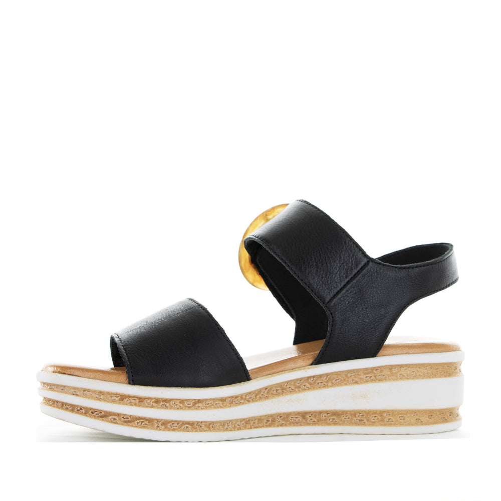 Black Le Sansa Guard sandals with open toe design and ankle straps, stylish footwear for casual or summer wear.