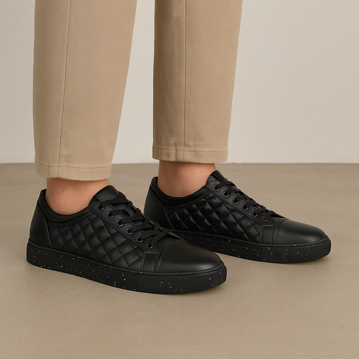 Black Le Sansa Manda sneakers with stylish design and comfortable fit, featuring sleek black material and modern athletic style.