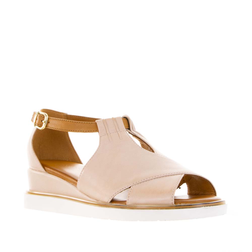 Le Sansa Tosca Blush Tan sandals with straps, showcasing a stylish and comfortable design in soft blush and tan tones.