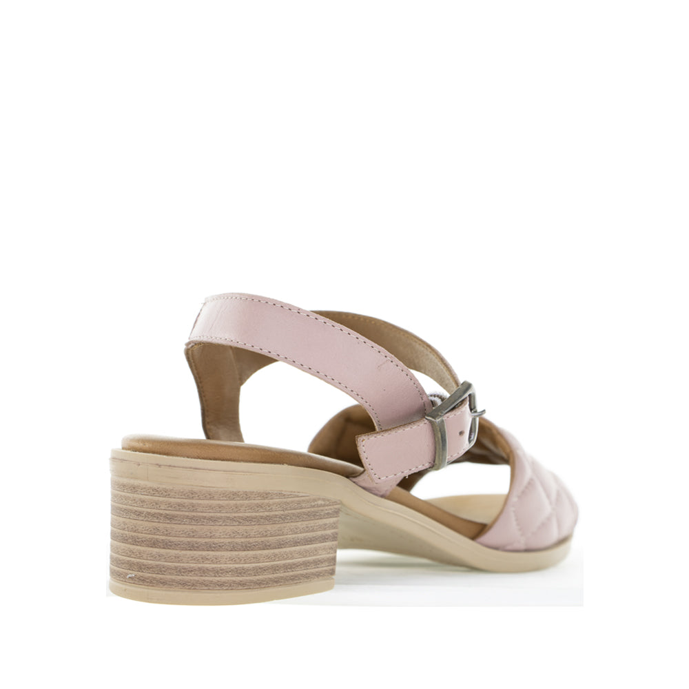 Le Sansa Lincoln Skin sandals featuring tan leather straps and a flat sole, stylish casual footwear for warm weather.