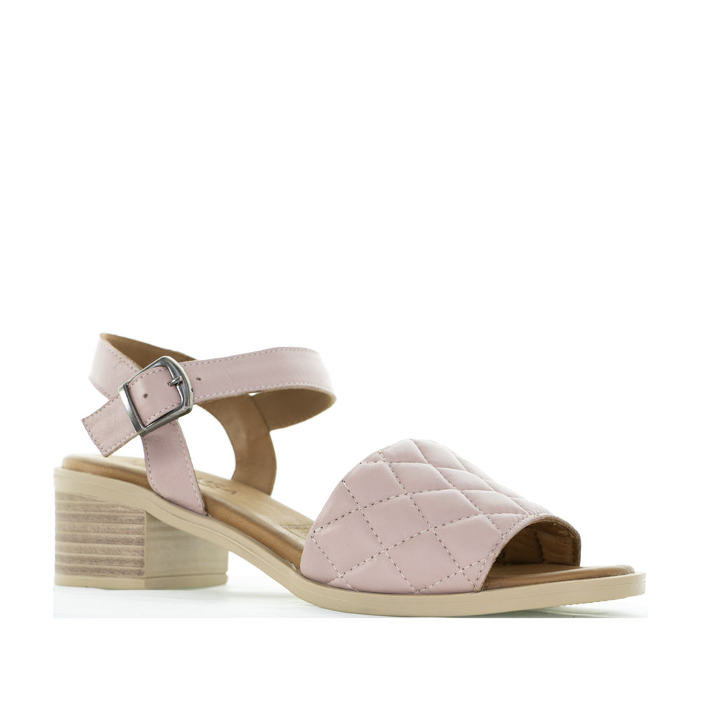 Le Sansa Lincoln Skin sandals featuring tan leather straps and flat soles, stylish footwear for casual wear.