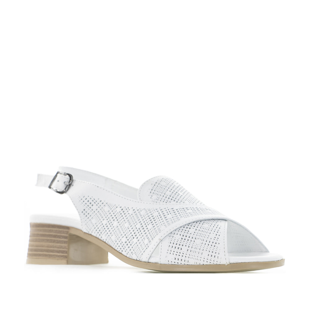 Le Sansa Lita White sandals featuring open-toe design and ankle straps, stylish footwear for casual summer wear.