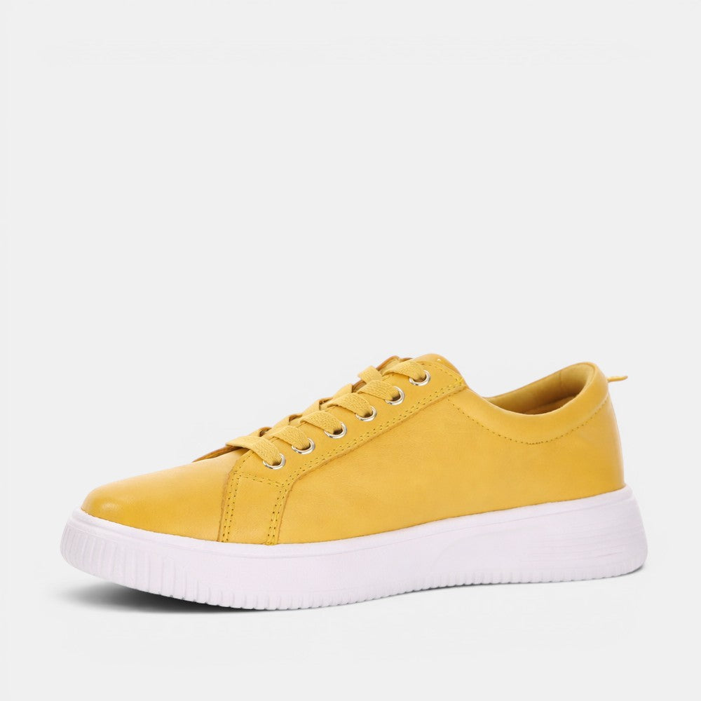 Naked Arches Nelly Mustard sneakers featuring mustard yellow color, comfortable design, and stylish casual footwear for women.